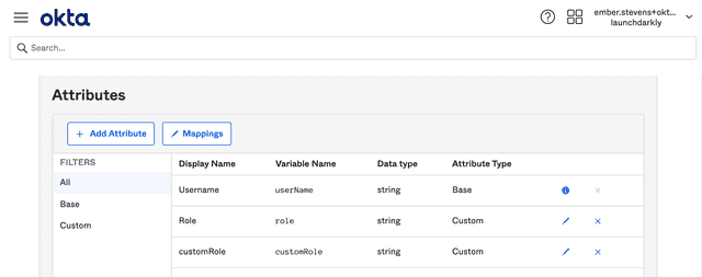 The Okta LaunchDarkly "Attributes" mapping screen with custom roles available.